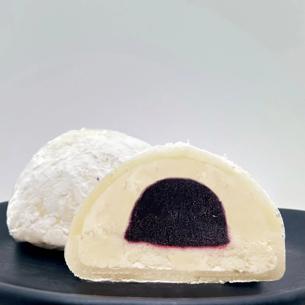 Cut-open cheesecake Mochiai with blueberry centre by Ochiai Professional