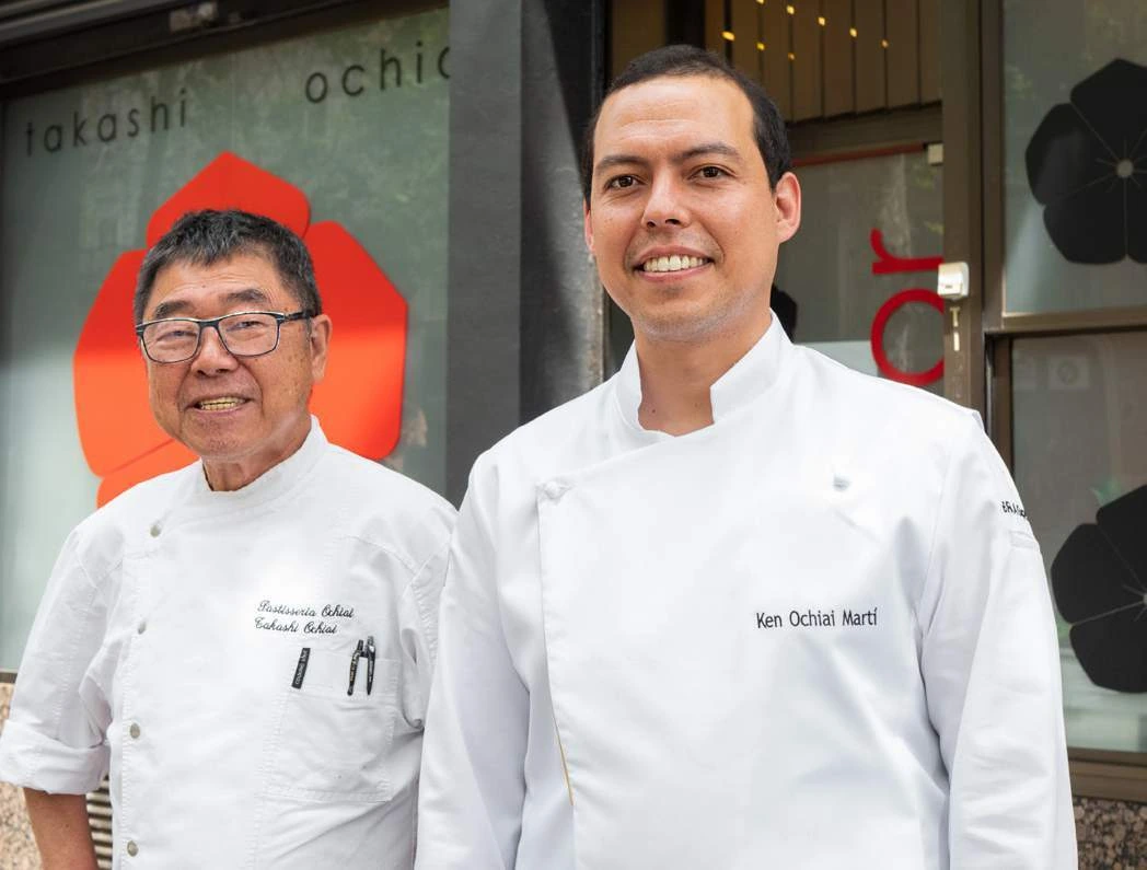 Takashi Ochiai and Ken Ochiai Martí together in pastry chef jackets outside the family pastry shop